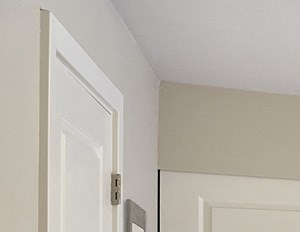 Large, carpeted primary bedroom with two sliding door closets along far wall. Sliding glass door to out door balcony. Bedroom fits a king sized bed.